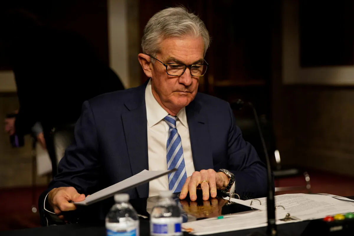 Federal Reserve Chair Jerome Powell prepares to testify before a Senate Banking Committee hybrid hearing on oversight of the Treasury Department and the Federal Reserve on Capitol Hill in Washington, on Nov. 30, 2021. (Elizabeth Frantz/Reuters)