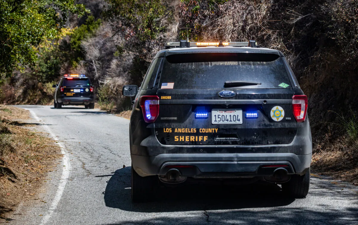 Los Angeles County Sheriffs Department with the Homeless Outreach Services Team patrol Malibu Canyon to assist homeless individuals on Sept. 24, 2021. (John Fredricks/The Epoch Times)