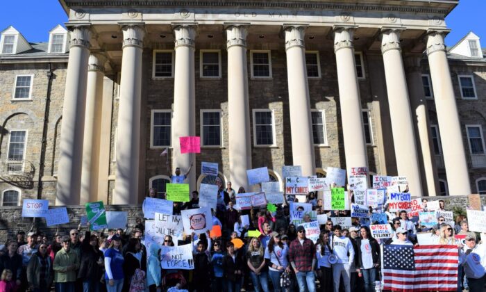 Penn State employees gathered for a health freedom rally in front of Old Main on Penn State’s campus, on Nov. 12, 2021. (Beth Brelje/The Epoch Times)
