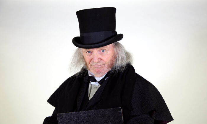 Richard Doyle plays Ebenezer Scrooge in A Christmas Carol by Charles Dickens adapted by Jerry Patch and directed by Hisa Takakuwa, at South Coast Repertory in Costa Mesa, Calif., from Nov. 27 to Dec. 26, 2021. (Nicholas Pilapil/SCR)