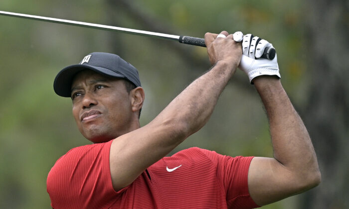 Tiger Woods watches his tee shot on the fourth hole during the final round of the PNC Championship golf tournament in Orlando, Fla., on Dec. 20, 2020. (Phelan M. Ebenhack/AP Photo)