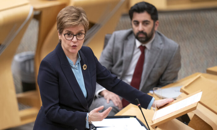 First Minister Nicola Sturgeon and former Cabinet Secretary for Justice (now Cabinet Secretary for Health and Social Care) Humza Yousaf at the Scottish Parliament in Edinburgh on Nov. 30, 2021. (Jane Barlow/PA)