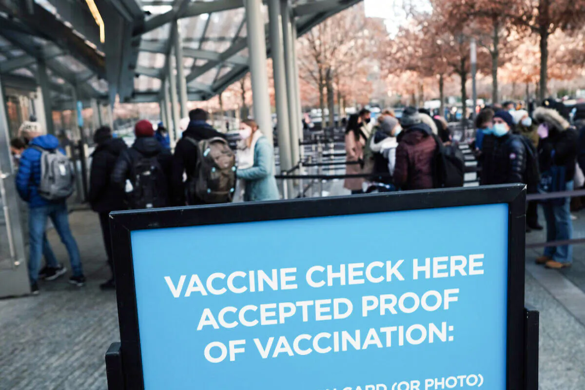 A sign asks for proof of vaccination in Manhattan at the entrance to a museum in New York City, on Nov. 29, 2021.(Spencer Platt/Getty Images)