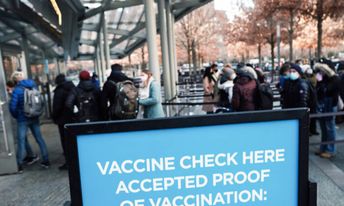 A sign asks for proof of vaccination in Manhattan at the entrance to a museum in New York City, on Nov. 29, 2021.(Spencer Platt/Getty Images)
