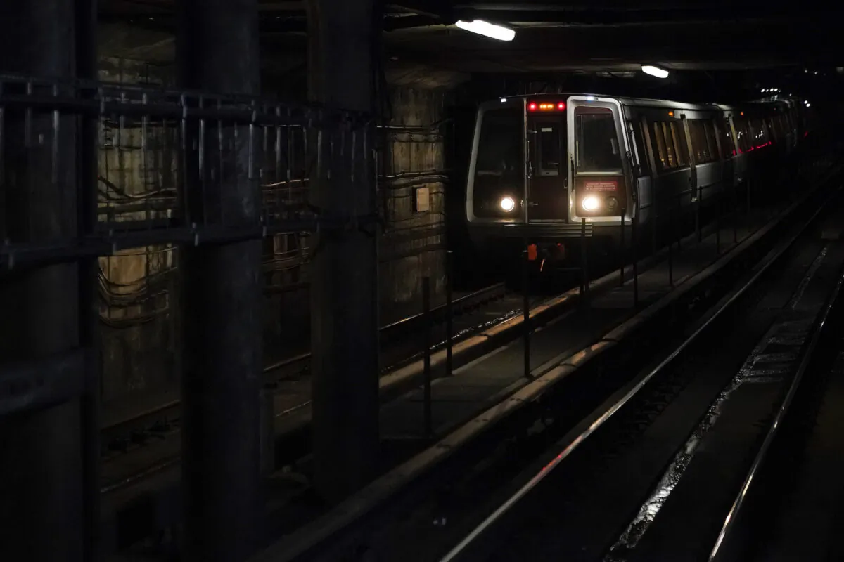 A Washington Metro train pulls into Dupont Circle station in D.C., on Nov. 24, 2021. (Patrick Semansky/AP Photo)