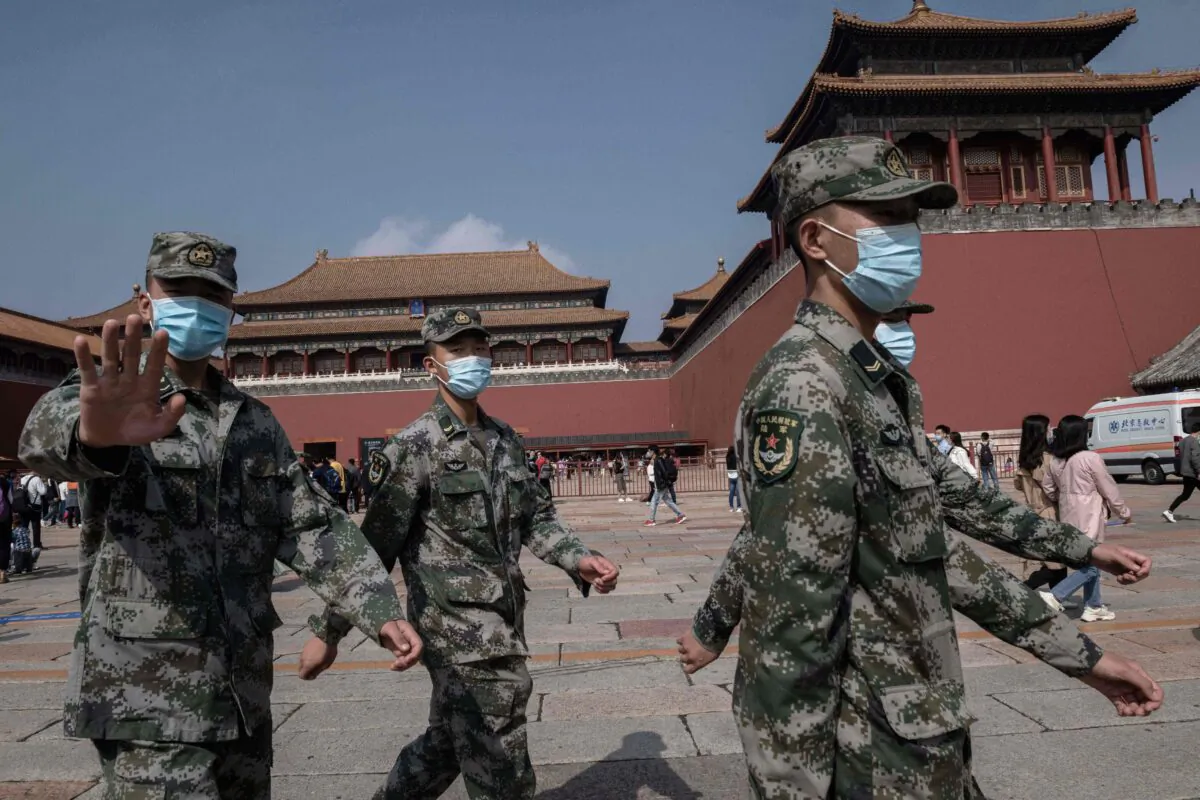 Chinese soldiers outside the Forbidden City in Beijing on Oct. 1, 2020. (Nicholas Asfouri/AFP via Getty Images)