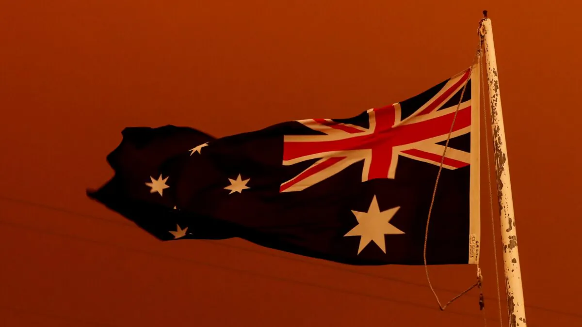 The Australia Flag flies under red skies during the Black Summer bushfires in East Gippsland, Australia, on Jan. 4, 2020. (Darrian Traynor/Getty Images)