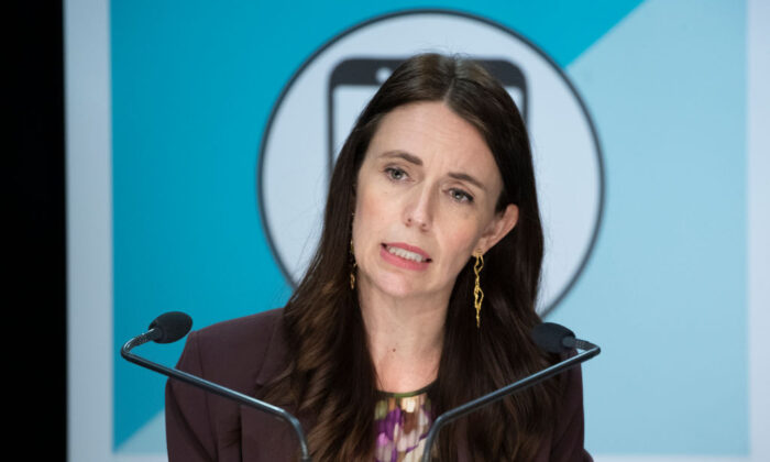 Prime Minister Jacinda Ardern speaks at a post-Cabinet press conference with Deputy Prime Minister Grant Robertson and director general of health Dr Ashley Bloomfield at the Beehive, Parliament in Wellington, New Zealand, on Nov. 29, 2021. (Mark Mitchell - Pool/Getty Images)