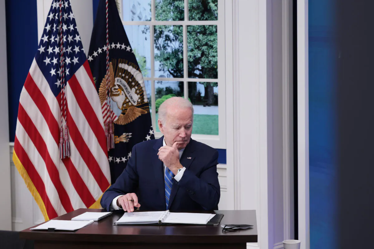 U.S. President Joe Biden listens during a video call with the White House COVID-19 Response team and the National Governors Association in the South Court Auditorium at the Eisenhower Executive Office Building in Washington on Dec. 27, 2021. (Anna Moneymaker/Getty Images)