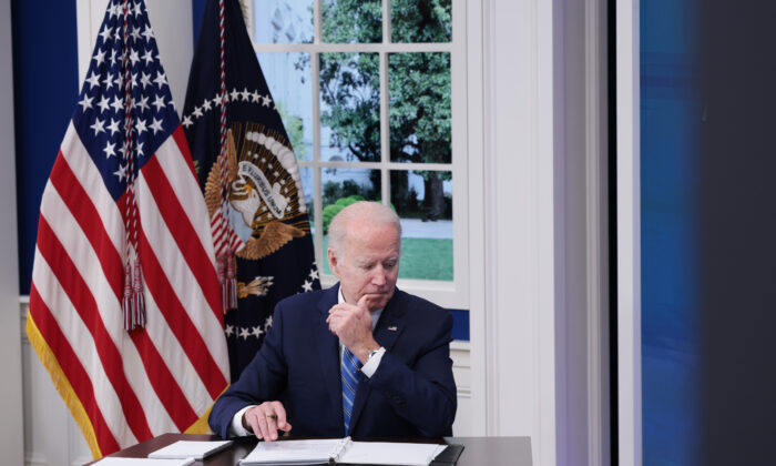 U.S. President Joe Biden listens during a video call with the White House COVID-19 Response team and the National Governors Association in the South Court Auditorium at the Eisenhower Executive Office Building in Washington on Dec. 27, 2021. (Anna Moneymaker/Getty Images)