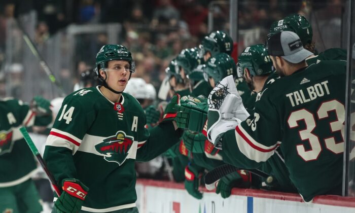 Minnesota Wild center Joel Eriksson Ek (14) celebrates with teammates after scoring a goal against the Arizona Coyotes in the first period at Xcel Energy Center in Saint Paul, Minn., on Nov. 30. 2021. (David Berding/USA TODAY Sports via Field Level Media)