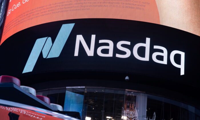 The Nasdaq logo is displayed at the Nasdaq Market site in Times Square in New York City, on Dec. 3, 2021. (Jeenah Moon/Reuters)