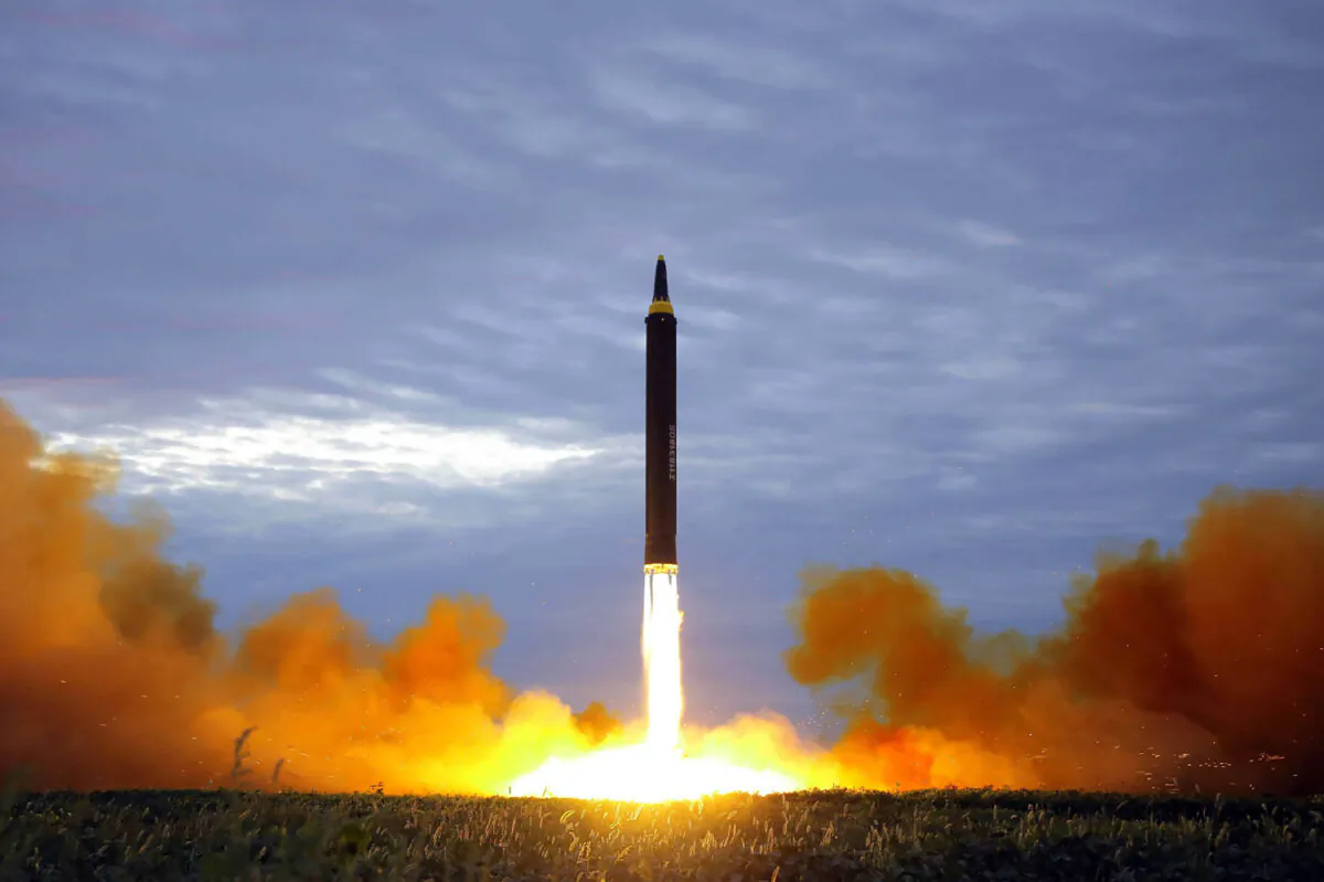 North Korea's intermediate-range strategic ballistic rocket Hwasong-12 lifting off from the launching pad at an undisclosed location near Pyongyang on Aug. 29, 2017. (STR/AFP via Getty Images)