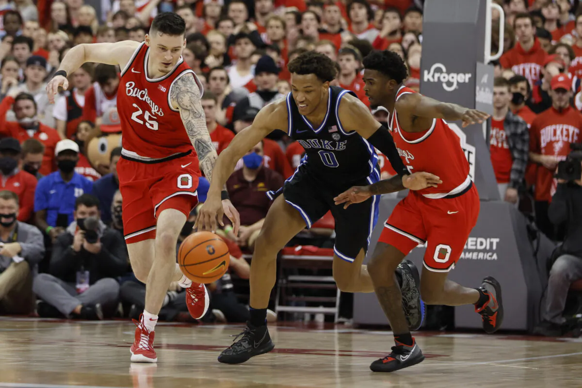 Ohio State's Kyle Young and Jamari Wheeler and Duke's Wendell Moore during the first half of an NCAA college basketball game in Columbus, Ohio, on Nov. 30, 2021. (Jay LaPrete/AP Photo)