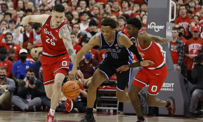 Ohio State's Kyle Young and Jamari Wheeler and Duke's Wendell Moore during the first half of an NCAA college basketball game in Columbus, Ohio, on Nov. 30, 2021. (Jay LaPrete/AP Photo)