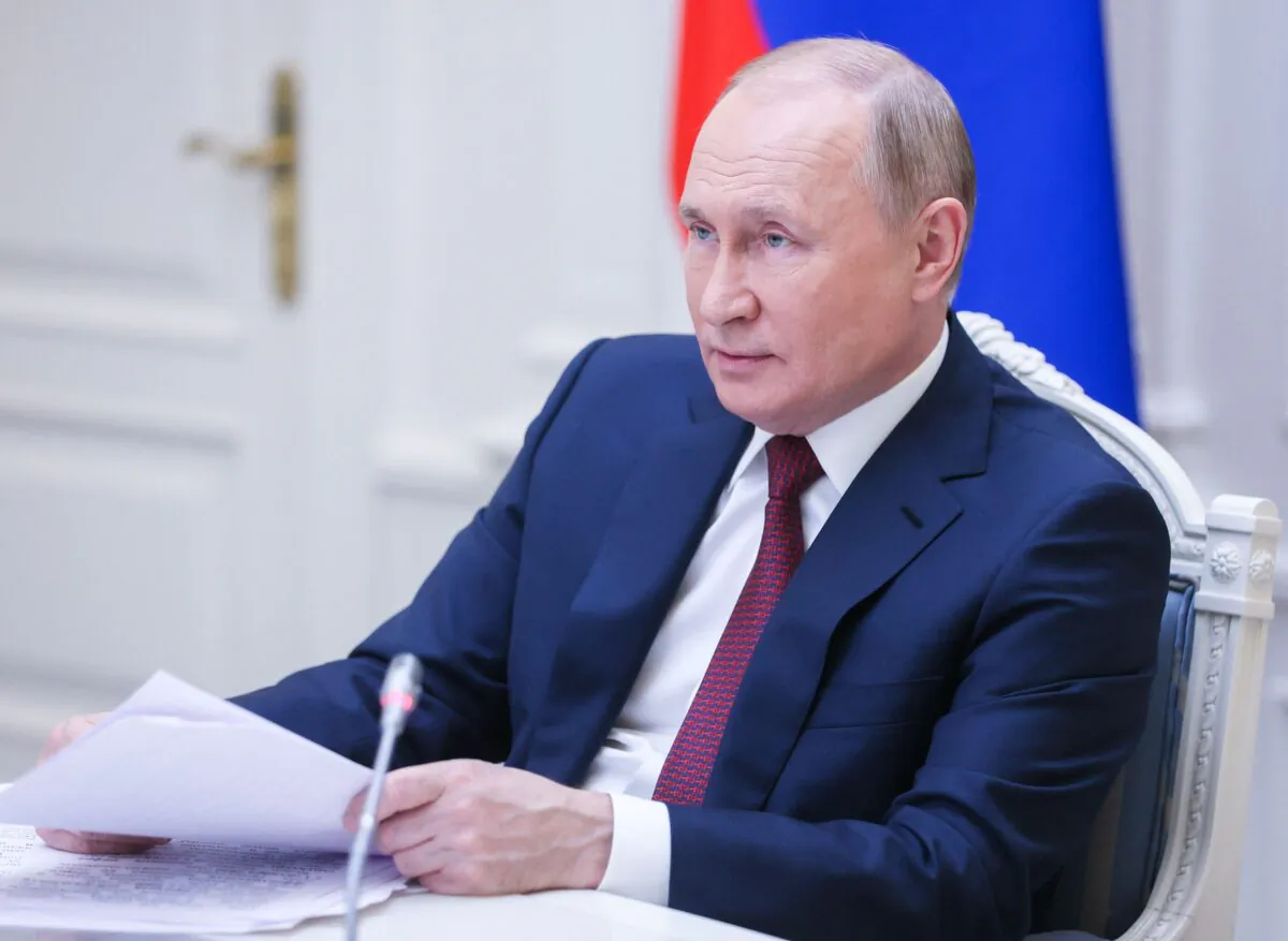 Russian President Vladimir Putin attends a forum at the Presidential Executive Office in Moscow, on Nov. 30, 2021. (Mikhail Metzel/AFP via Getty Images)
