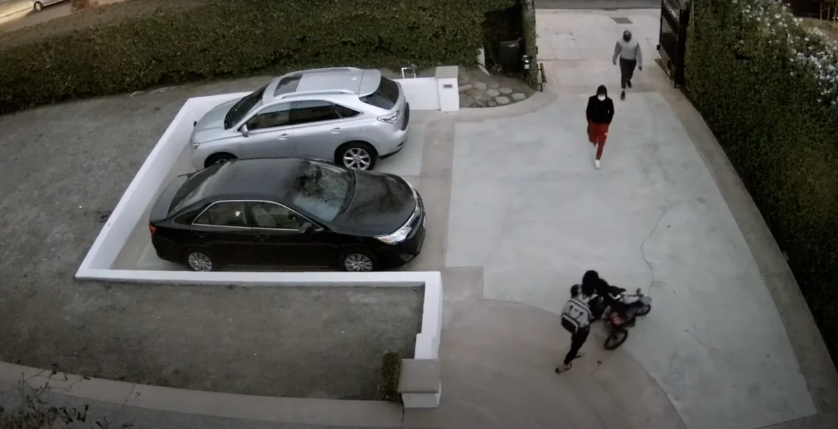 A screenshot of security footage of a daytime robbery in Hancock Park, Calif., on Nov. 28, 2021. (Courtesy of the Los Angeles Police Department)