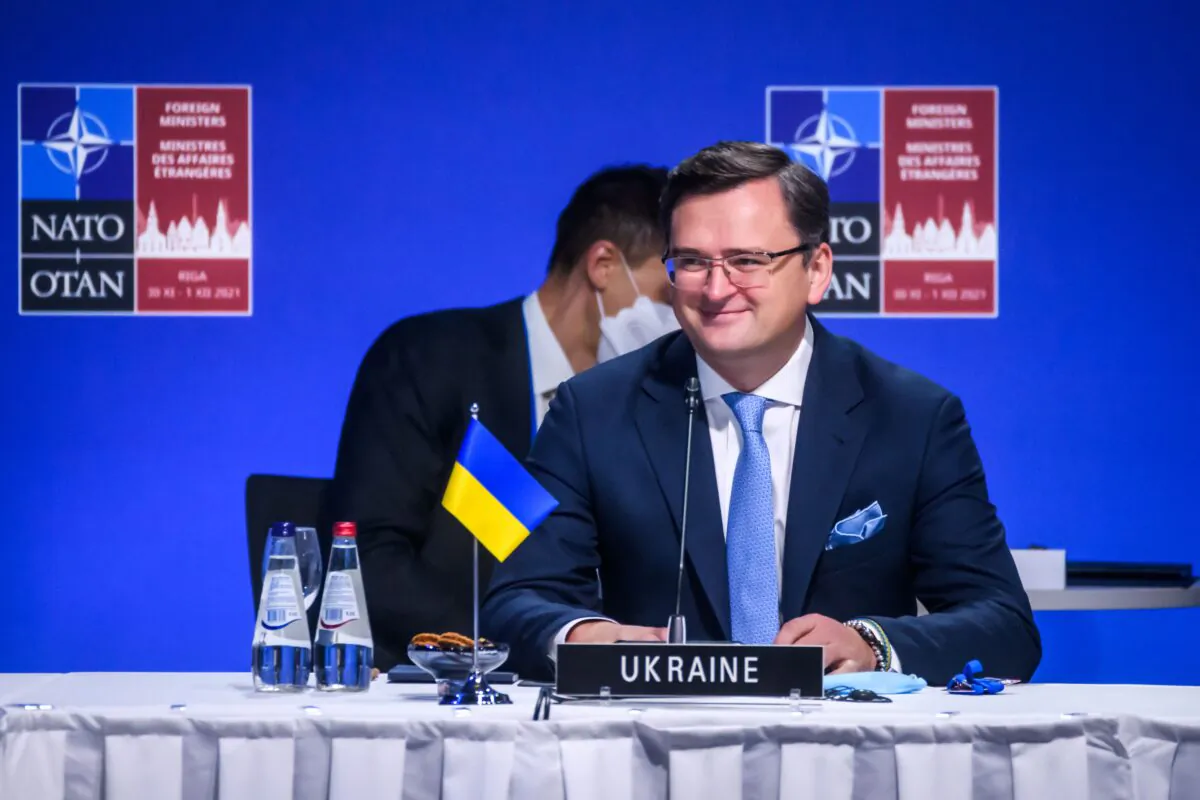 Ukraine's Foreign Minister Dmytro Kuleba (R) attends a session of a NATO Foreign Ministers meeting with Georgia and Ukraine in Riga, Latvia, on Dec. 1, 2021. (Gints Ivuskans/AFP via Getty Images)