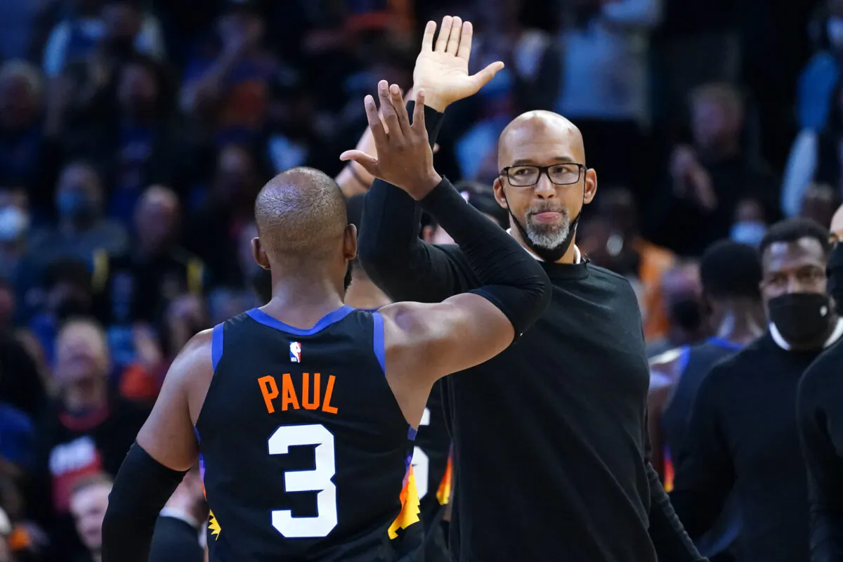 Phoenix Suns guard Chris Paul (3) high fives head coach Monty Williams during the second half of an NBA basketball game against the Golden State Warriors in Phoenix, on Nov. 30, 2021. The Suns won 104–96. (Matt York/AP Photo)