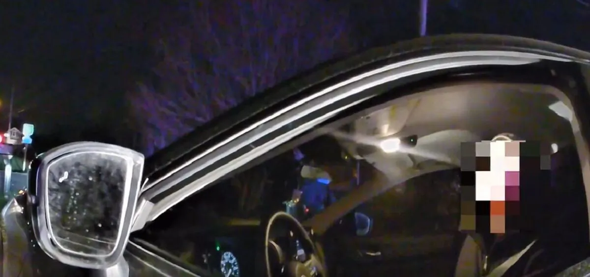 In this image from body camera video, NBC producer James J. Morrison is seen speaking to police officers in Kenosha, Wis., on Nov. 17, 2021. (The Epoch Times via Kenosha Police Department)