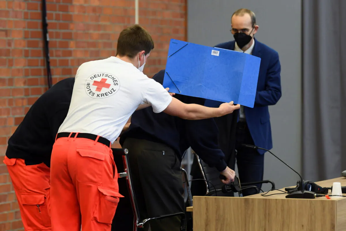 A 101-year-old former security guard of the Sachsenhausen concentration camp appears in the courtroom before his trial at the Landgericht Neuruppin court, Brandenburg, Germany, on Dec. 2, 2021. (Annegret Hilse/Reuters)