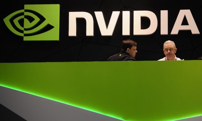 People gather in the Nvidia booth at the Mobile World Congress mobile phone trade show in Barcelona, Spain, on Feb. 27, 2014. (Manu Fernandez/AP Photo)