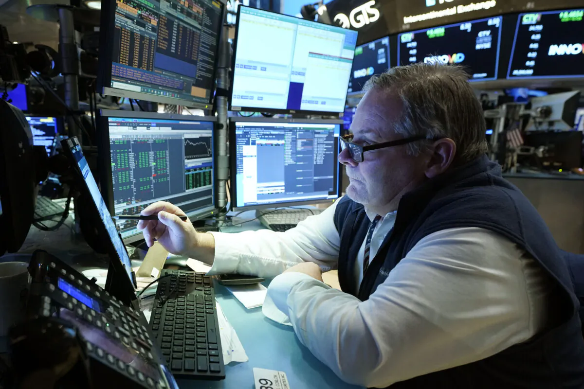 Trader Michael Conlon works on the floor of the New York Stock Exchange on Dec. 1, 2021. (Richard Drew/AP Photo)