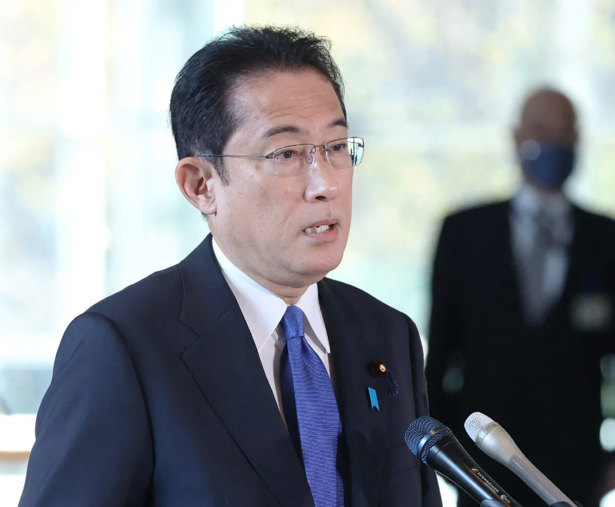 Japan's Prime Minister Fumio Kishida answers questions from reporters regarding the response to the Omicron COVID-19 variant at his office in Tokyo on Nov. 29, 2021. (JIJI Press/AFP via Getty Images)