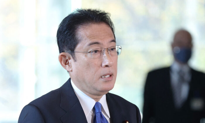 Japan's Prime Minister Fumio Kishida answers questions from reporters regarding the response to the Omicron COVID variant at his office in Tokyo on Nov. 29, 2021. (JIJI Press/AFP via Getty Images)