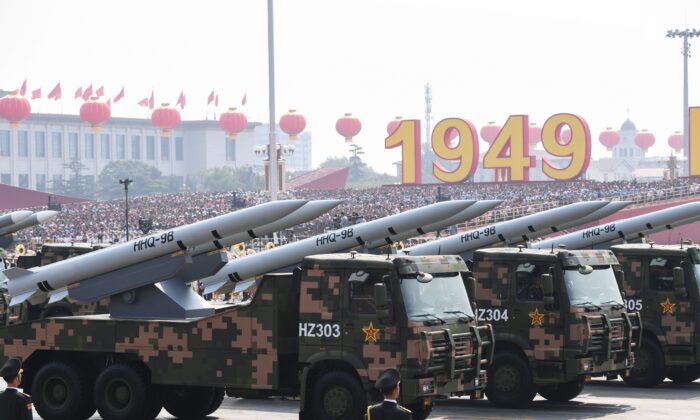 Military vehicles carrying HHQ-9B surface-to-air missiles participate in a military parade at Tiananmen Square in Beijing on Oct. 1, 2019. (Greg Baker/AFP via Getty Images)