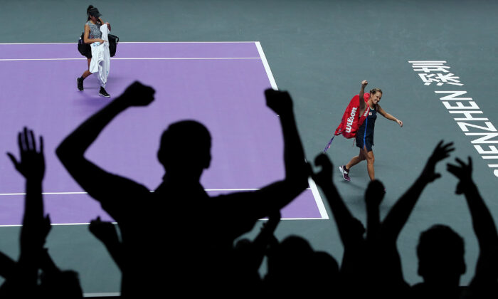 Barbora Strycova (R) of the Czech Republic and Su-Wei Hsieh of Chinese Taipei react to the crowd as they walk off the court after their Women's Doubles semifinal match victory over Anna-Lena Groenefeld of Germany and Demi Schuurs of the Netherlands on Day Seven of the 2019 Shiseido WTA Finals at Shenzhen Bay Sports Center in Shenzhen, China, on Nov. 2, 2019. (Lintao Zhang/Getty Images)