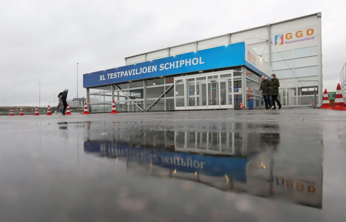 People walk outside XL Schiphol test pavilion in Amsterdam, Netherlands, on Nov. 27, 2021. (Eva Plevier/Reuters)