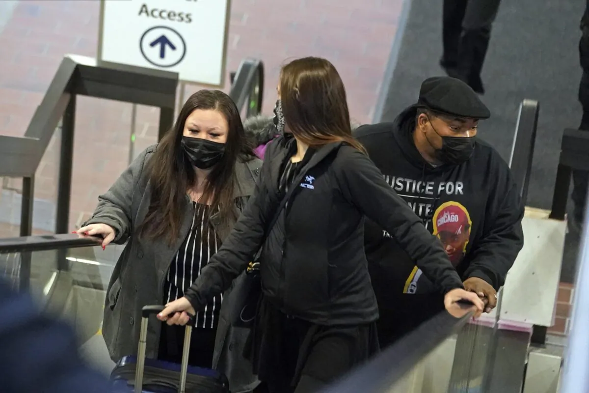 Katie Wright, the mother of Daunte Wright, left, and his father, Arbuey Wright, right, arrive at the Hennepin County Government Center in Minneapolis, on Dec. 2, 2021. (Jim Mone/AP Photo)