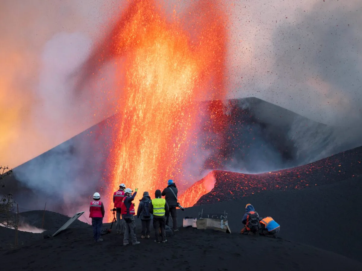 Scientists from CSIC (Spanish National Research Council) take geophysics measurements on the Canary Island of La Palma, Spain, on Nov. 13, 2021.  (Taner Orribo/AP Photo)