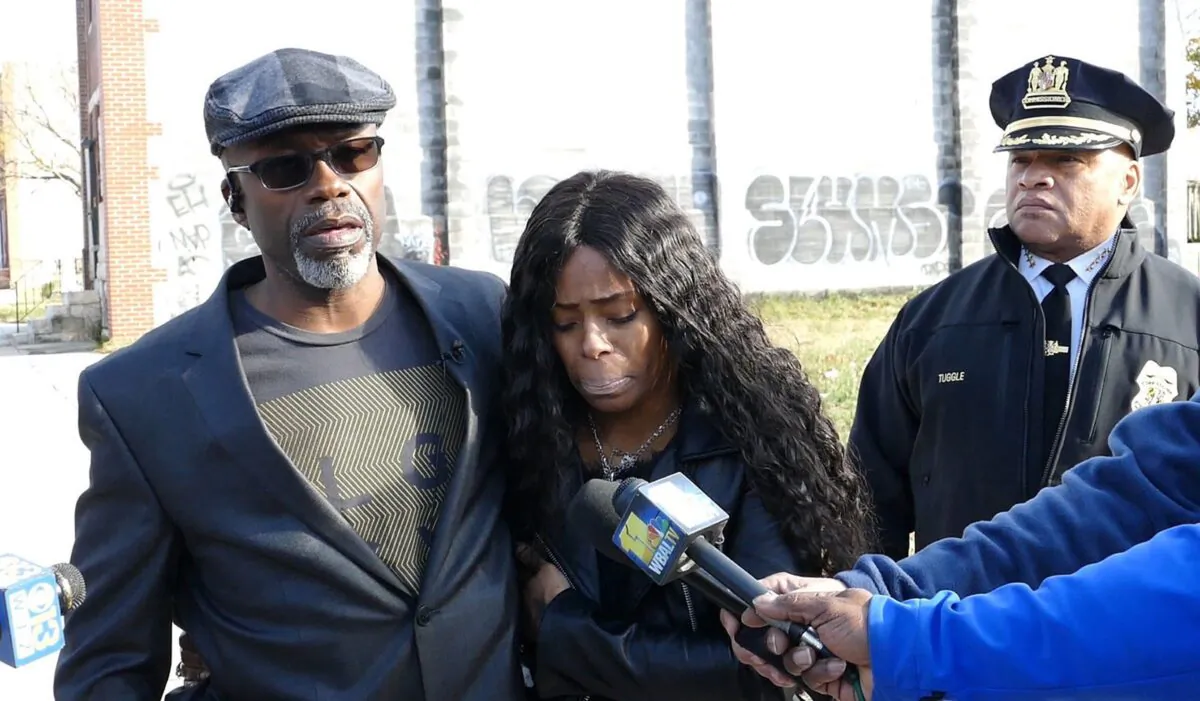 Keith Smith, along with his daughter Valeria Smith, talks with the media in the area where his wife Jacquelyn Smith was killed in Baltimore, in Dec. 2018. (Kevin Richardson/The Baltimore Sun/TNS)