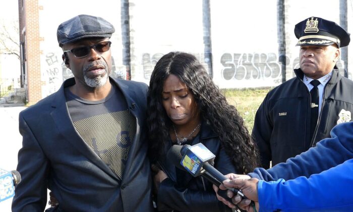 Keith Smith, along with his daughter Valeria Smith, talks with the media in the area where his wife Jacquelyn Smith was killed in Baltimore, in Dec. 2018. (Kevin Richardson/The Baltimore Sun/TNS) 