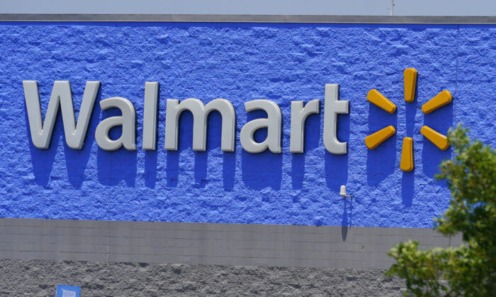 A sign at a Walmart store is pictured in Oklahoma City, on Thursday, June 24, 2021. (AP Photo/Sue Ogrocki)