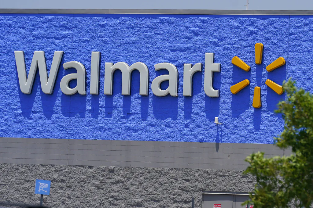 A sign at a Walmart store is pictured Thursday, June 24, 2021, in Oklahoma City. (AP Photo/Sue Ogrocki)