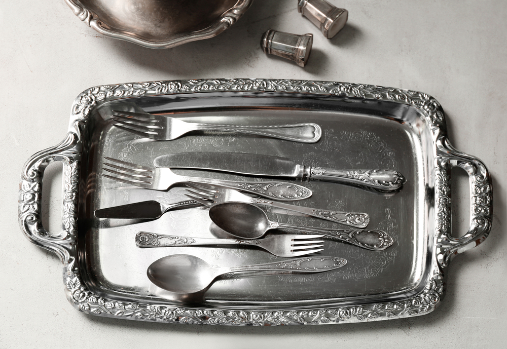 The dishwasher is an excellent way to take care of cleaning silver plate as well as sterling silver flatware. (Africa Studio/Shutterstock)