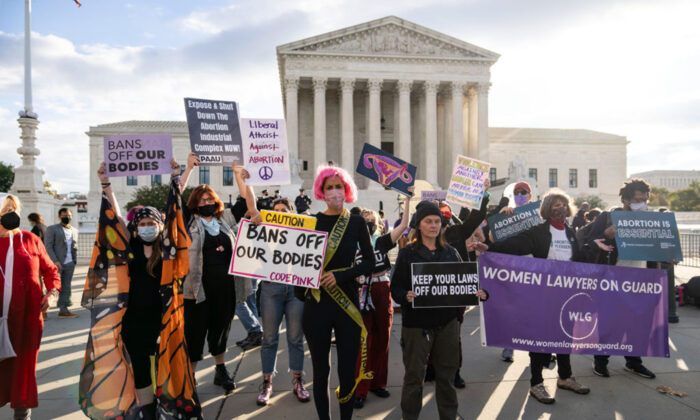 Abortion rights supporters and anti-abortion advocates rally outside the U.S. Supreme Court in Washington on Nov. 1, 2021. (Getty Images)