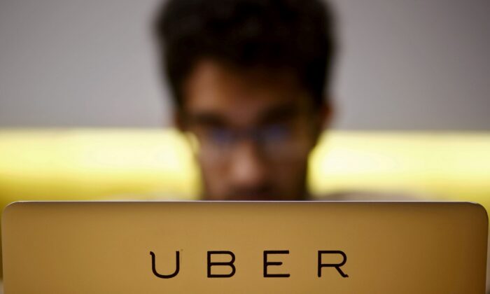 An employee works inside the office of U.S. online cab-hailing company Uber, on the outskirts of New Delhi, India, on April 24, 2015. (Anindito Mukherjee/Reuters)