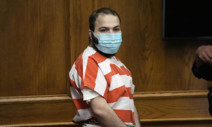 Ahmad Al Aliwi Alissa, accused of killing 10 people at a Colorado supermarket in March, is led into a courtroom in Boulder, Colo., on Sept. 7, 2021. (David Zalubowski/AP Photo)