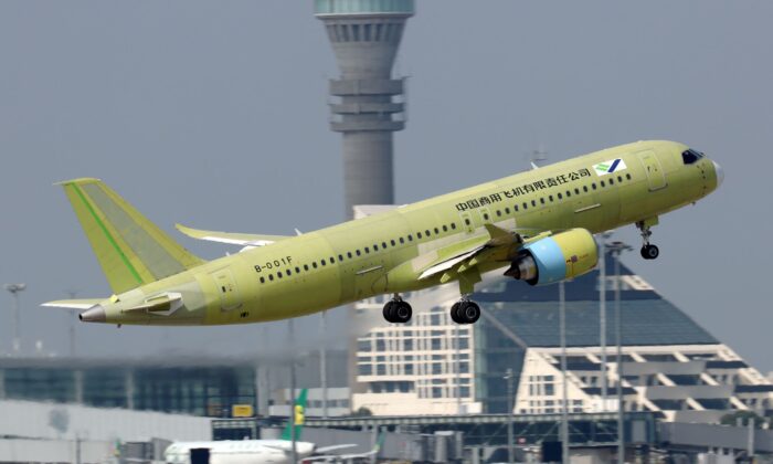 The fifth prototype of China's home-built C919 passenger plane takes off for its first test flight from Shanghai Pudong International Airport in Shanghai, China, on Oct. 24, 2019. (Stringer/Reuters)