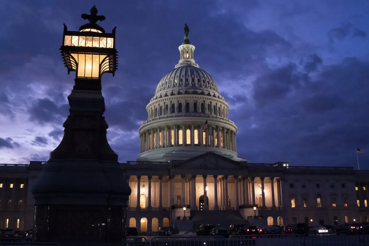 Night falls at the Capitol in Washington, on Dec. 2, 2021. (AP Photo/J. Scott Applewhite)