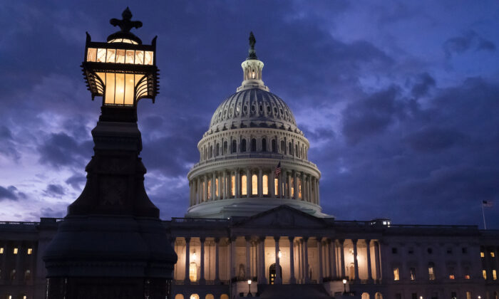 Night falls at the Capitol in Washington, on Dec. 2, 2021. (AP Photo/J. Scott Applewhite)