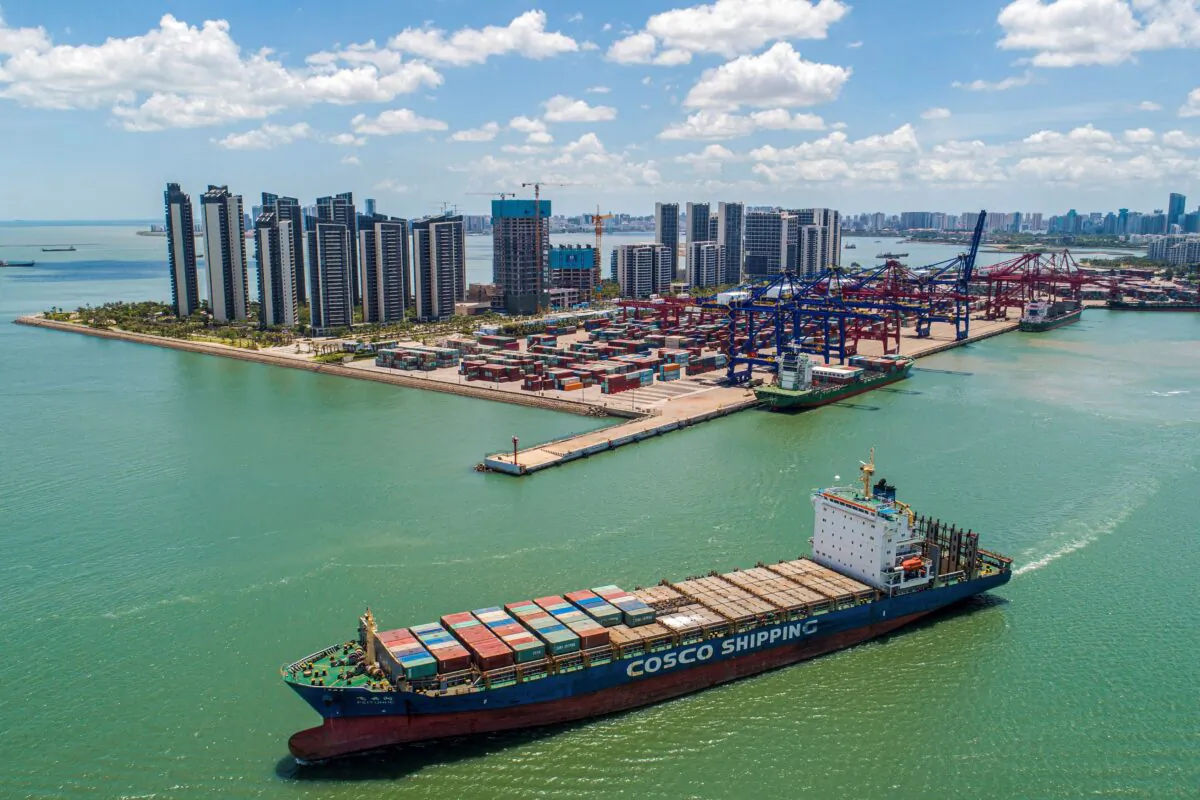 A cargo ship loaded with containers leaves a port in Haikou, Hainan province, China, on May 17, 2021. (STR/AFP via Getty Images)