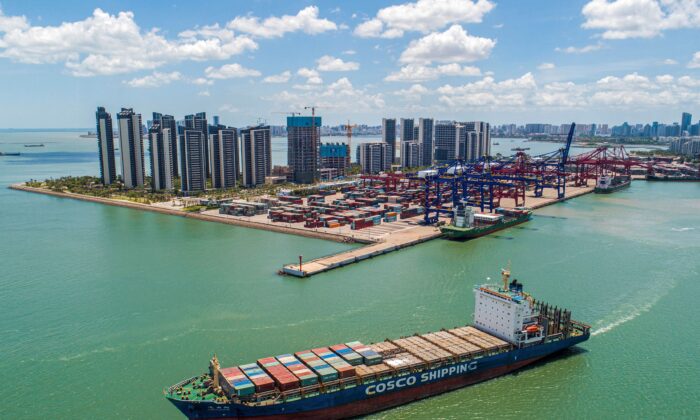 A cargo ship loaded with containers leaves a port in Haikou, Hainan province, China, on May 17, 2021. (STR/AFP via Getty Images)