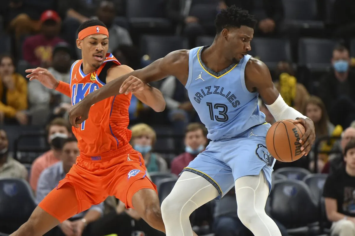 Memphis Grizzlies forward Jaren Jackson Jr. (13) handles the ball against Oklahoma City Thunder forward Darius Bazley (7) during the first half at FedExForum, in Memphis, Tenn., on Dec. 2, 2021. (Justin Ford/USA TODAY Sports via Field Level Media)
