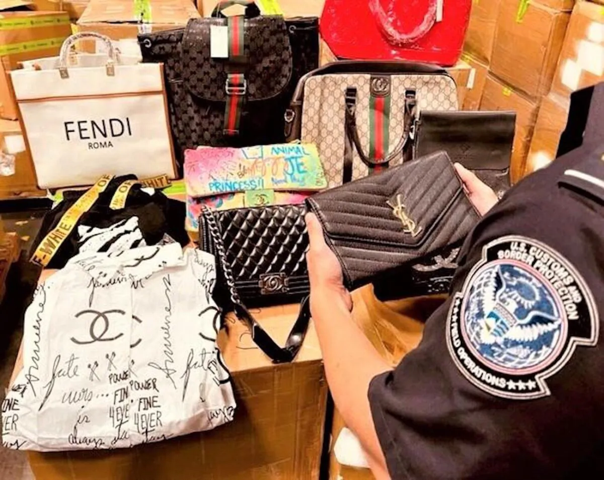 CBP in Los Angeles  intercepted 13,586 counterfeit
designer products arriving in a containerized cargo
shipment from China on Nov. 9, 2021. (U.S. Customs and Border Protection)