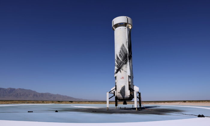 Blue Origin's reusable rocket engine New Shepard is seen on a landing pad after carrying a capsule with Star Trek actor William Shatner, 90, and three others on billionaire Jeff Bezos's company's second suborbital tourism flight near Van Horn, Texas, on Oct. 13, 2021. (Mike Blake/Reuters)
